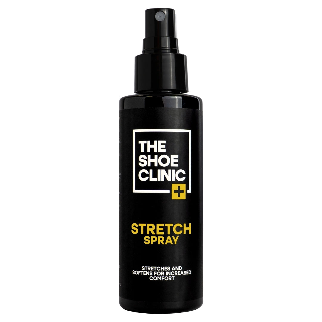 Black bottle of The Shoe Clinic stretch spray on a white background