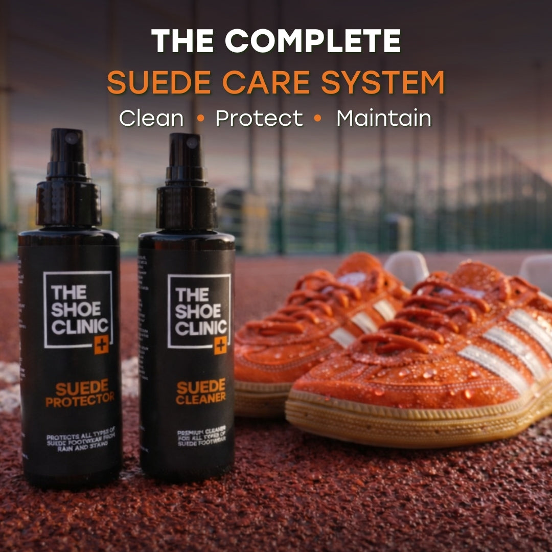 Two bottles of The Shoe Clinic suede care products with wet orange suede shoes on a textured running surface.